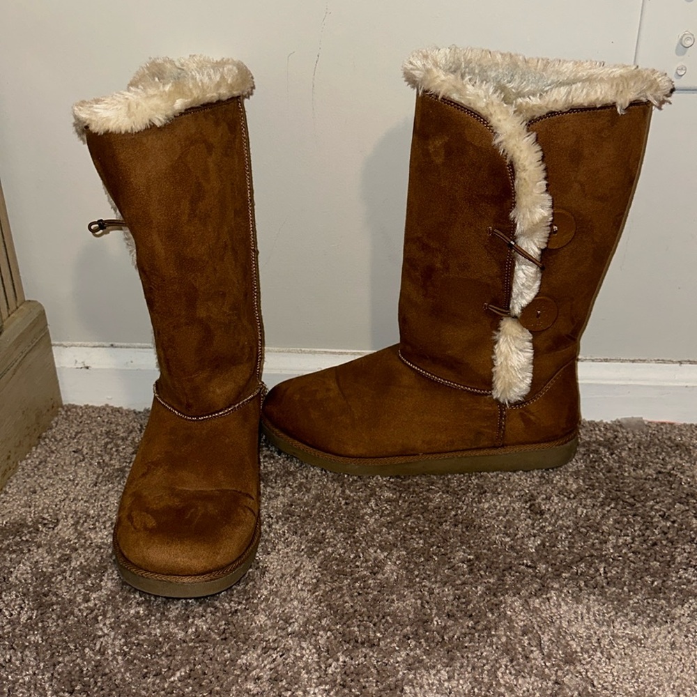 Brown boots with white fur(not real fur)Worn blue ink at top from jeans